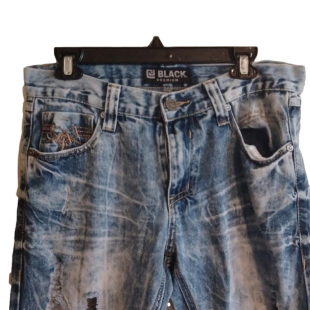 Black brand super distressed, acid wash looking jeans.Size 30x32.